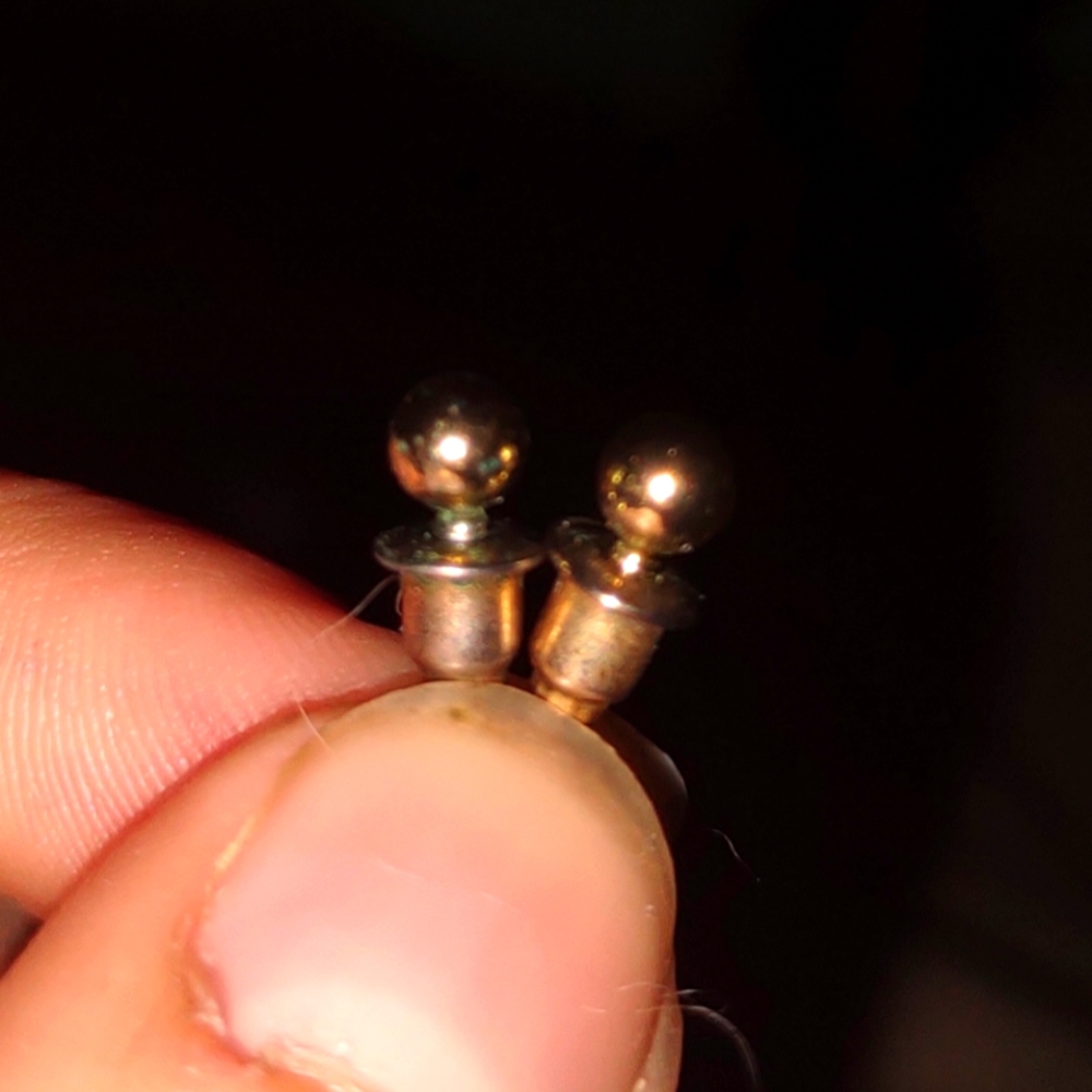 Two mini gold stud earrings